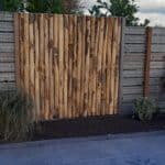 Schutting van halfronde kastanje palen | Adéquat